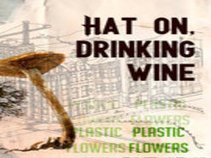 Hat on, Drinking Wine