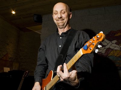 Paul Arow playing musicman electric guitar