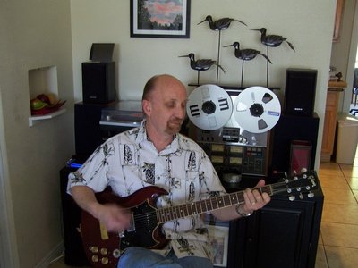 Paul Arow playing 69 SG Gibson with vintage Teac 3340 background
