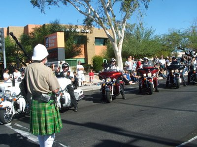 Saluting the El Zaribah Motorcycle Unit at the London Bridge Days Parade, Lake Havasu City, Az 