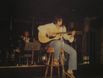 Performing my original song "Stay Awhile" aboard "The Fairwind" on a carribean cruise. (1979)
