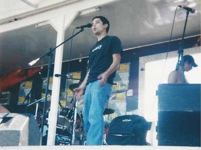 Performing on stage in Observatory, South Africa