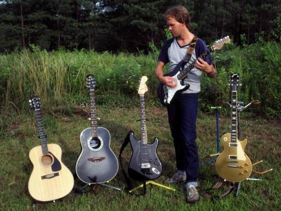 I still have the middle three, the acoustic on the left and the Les Paul on the right were sold off