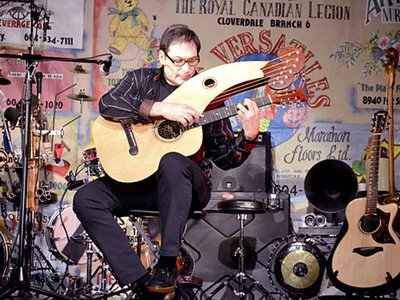 Alder playing Harp Guitar