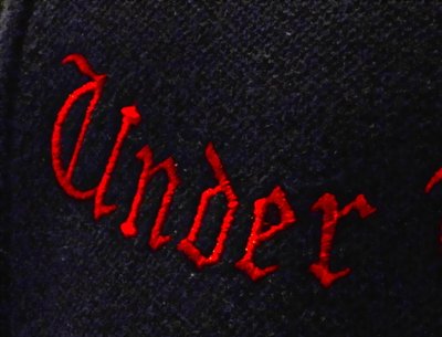 Close up of embroidered ball cap.