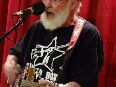 Gerry Thompson on his 4 string "Box of Dreams" Cigar Box Guitar