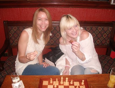 Me and my friend Michelle playing chess .. Well trying 2 ; )  to relax b4 my performance 