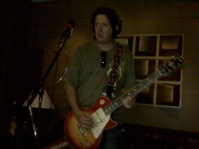 A LES PAUL WITH THREE PICK UP'S........CARE TO GUESS WHO'S IT IS? LOL!