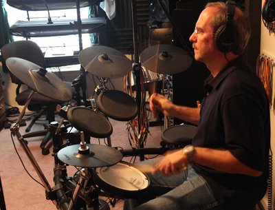 Warren playing drums in the studio, during the "Compass Rose" recording sessions
