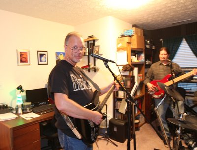 Mike on guitar and Jonathan on bass, in the studio.