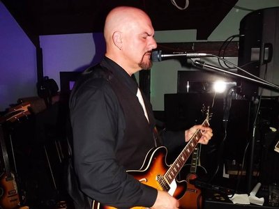 Mark Owens, the Apple Core's "Lennon" vocalist and rhythm guitarist