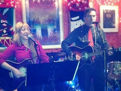 Michelle Murray and Buck Stone performing at the Christmas benefit concert at the Outta the Way Cafe