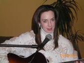 Kim playing guitar at private New Year's Party '09