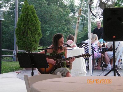 Kim playing guitar at Comus Inn 6/08