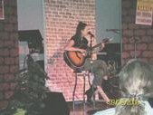 Kim playing guitar at MVC Coffee House 9/08