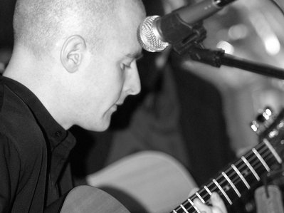 playing acoustic guitar