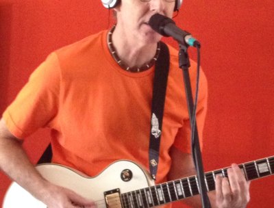 Mike singing and playing lead guitar