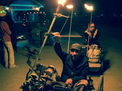 Janover & reSunator on The RealmsMobile - Janover's fire-drum-trike at Burningman 2012