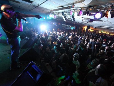 Q pointing at the crowd