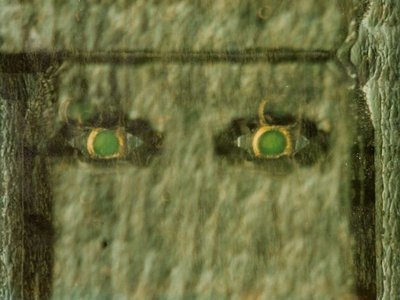 Back-lit Thru-wafer via of contacts in Indium Phosphide based device.
