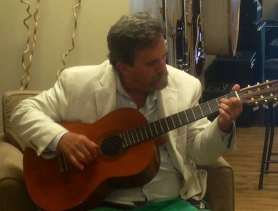 corey steele on classical guitar at Tremolo instruments new location