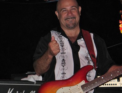 IN BETWEEN SONGS AT AN OUTDOORS FESTIVAL 