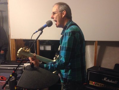 Mike Snow picking and singing