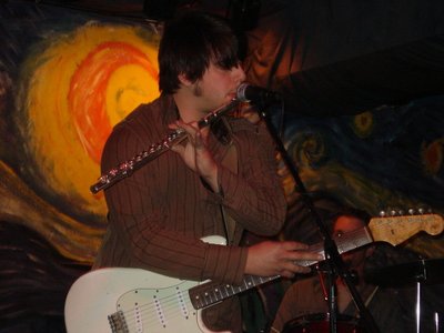 Playin' guitar and flute at the same time