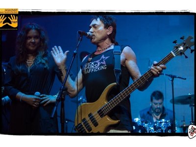 Andy Fraser and Joanna Pearl on stage at the Rock Against Human Trafficking after-Grammy party 
