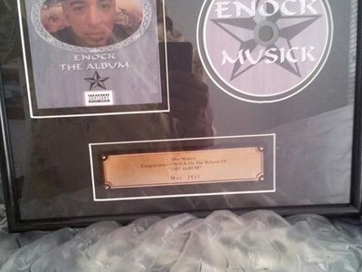My plaque for my first ever album release. "The Album" by Enock