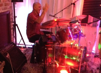 Jack tossing his drum sticks ... the low ceiling didn't help ... his eye is much better now ... ;)