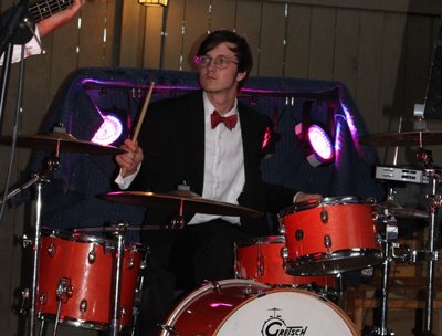 Leighton playing drums.