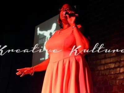 Performing at the 10th Anniversary of the Black Poetry Cafe in Atlanta, GA