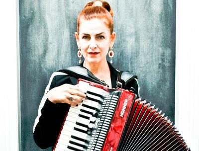 Joanna plays accordion as Baroness Bianka