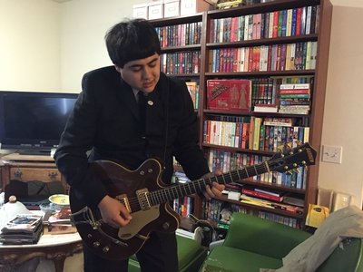 Alec Lewis as George Harrison.