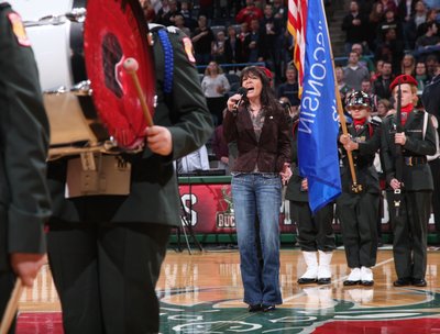 Cheryl singing National Anthem at Milwaukee Bucks game