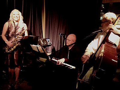 Suzanne Grzanna playing her saxophone at The Packing House...Ray Tabs - Piano, Hal Miller- Bass