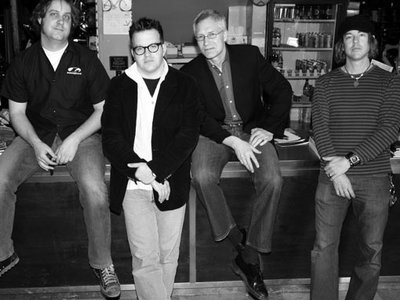 Clockwise: Jason Eagan (bass/vocals) James Pollock (drums) Claude Kent (lead vocals/rhythm guitar) B
