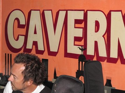 Clockwise's lead guitarist Brent Welbourn in front of The Cavern Club sign.
