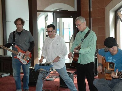 Clockwise performing live acoustically at the Brampton Art Fair in November 2007.
