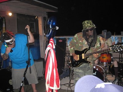 Cheezy from Cheezy and the Crackers rockin' the mic and the 1's and 2's