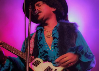 Jimy Bleu as Jimi Hendrix in Fillmore 68 look with Flying V guitar