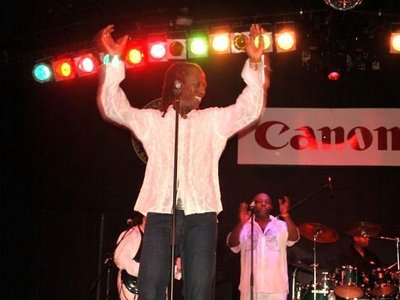 Tom smiles onstage July 2010
