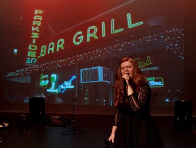 Still from Greencard Wedding's indie rock musical