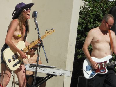 Riling up the angry rally crowd in Lanyard Park Amphitheater Freedom take the band on topless