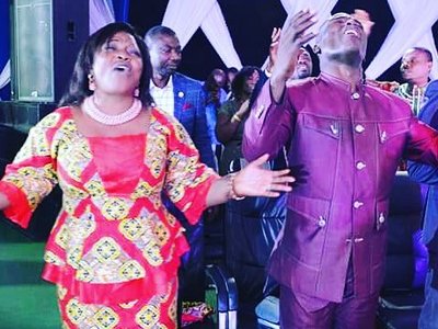 The audience worshiping God