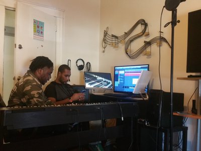 Ahkil and Fresh Dinero putting together rhymes for a track I created and produced