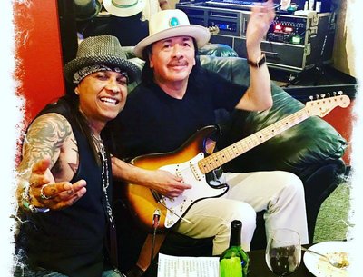 Carlos Santana and Micki Free backstage 