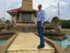Mohamed Dekkak Chairman and Founder of Adgeco Group standing near the Statue of the Don Stephen 
