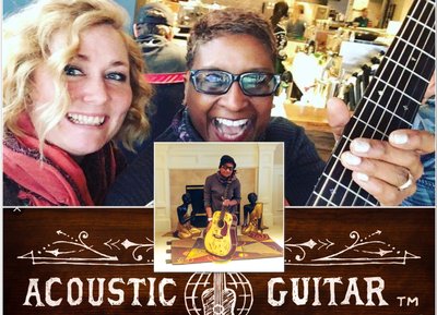 Fellow songwriter Jessica Lynne receives communal guitar from Paula